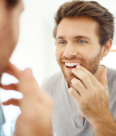 Patient in Washington NJ smiling after dental bridge restoration