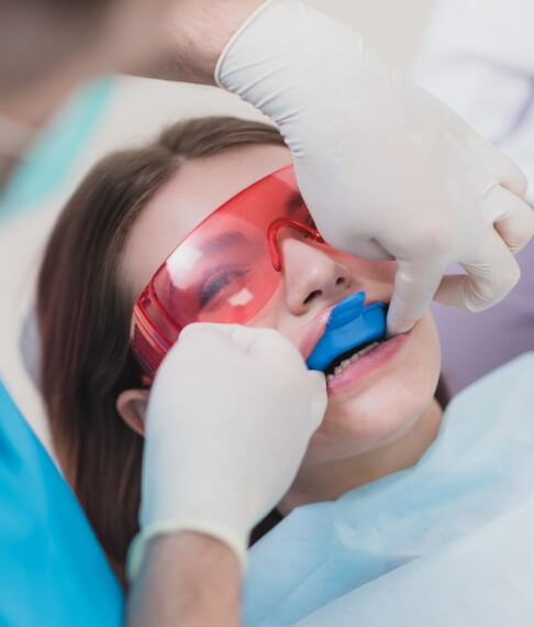 Young patient receiving fluoride treatment