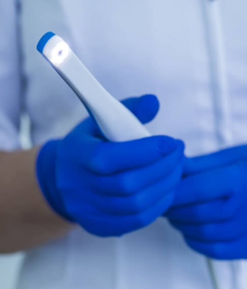 Dentist holding an intraoral camera