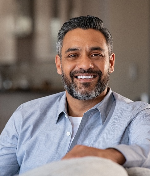 Middle-aged male showing off his healthier smile