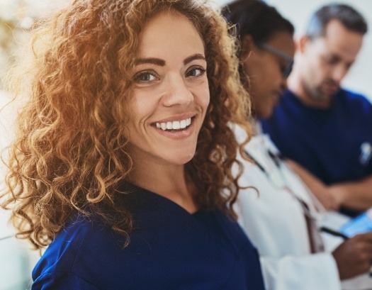 Smiling dental team member