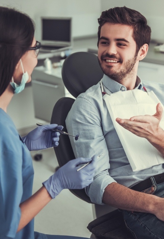 Dental patient talking to team member