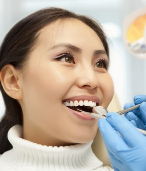 Woman receiving gum disease treatment