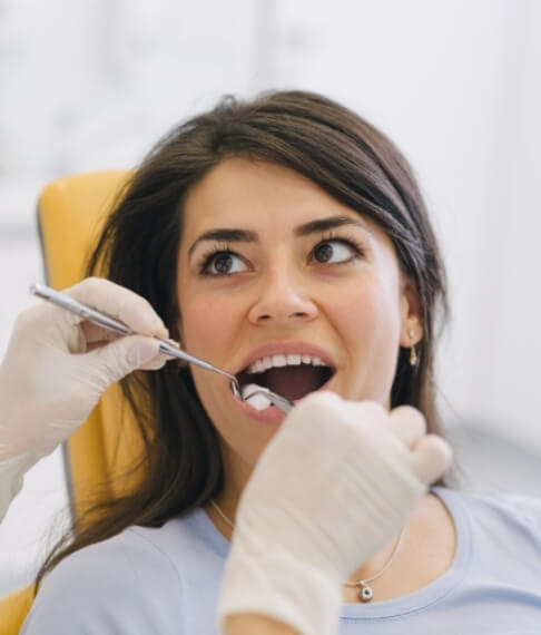 Dental patient receiving oral cancer screening